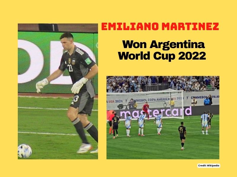 Emiliano Martinez holding World Cup trophy after Argentina’s 2022 win