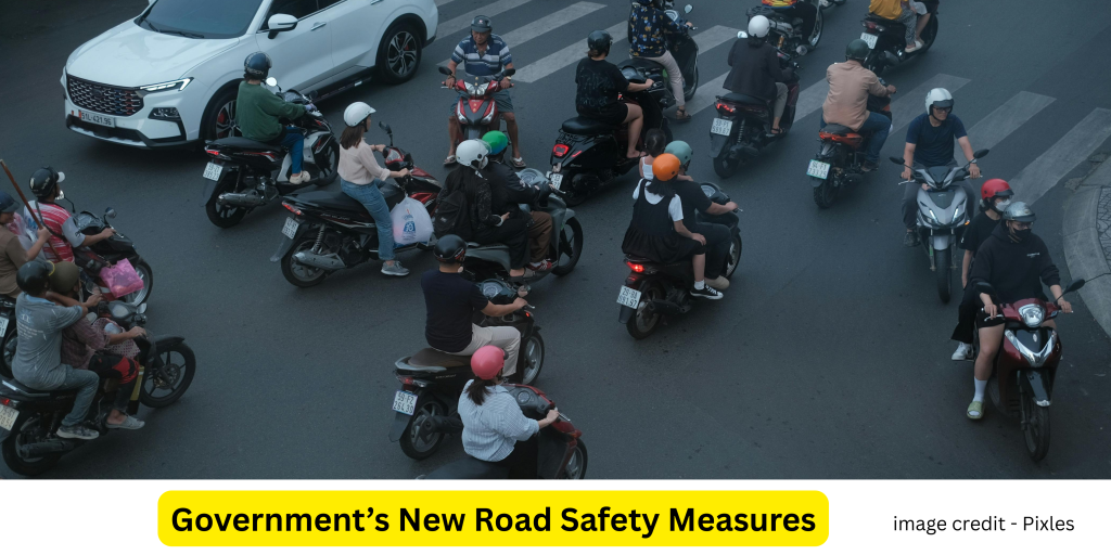Government officials discussing road safety plans with traffic signs and vehicles in the background


